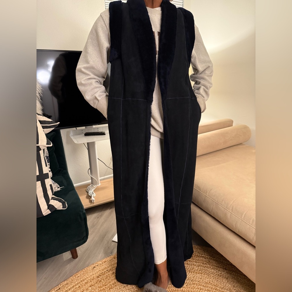 Stunning navy floor length reversible shearling vest. Never worn, has tags.